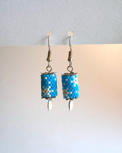 Beaded dangle earrings with snowflake design crafted in peyote stitch technique from Japanese Miyuki beads and enameled charms - Fleur Du Jour