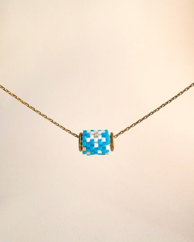 Single beaded pendant crafted in peyote stitch technique from Japanese Miyuki Delica beads in a snowflake design - Fleur Du Jour
