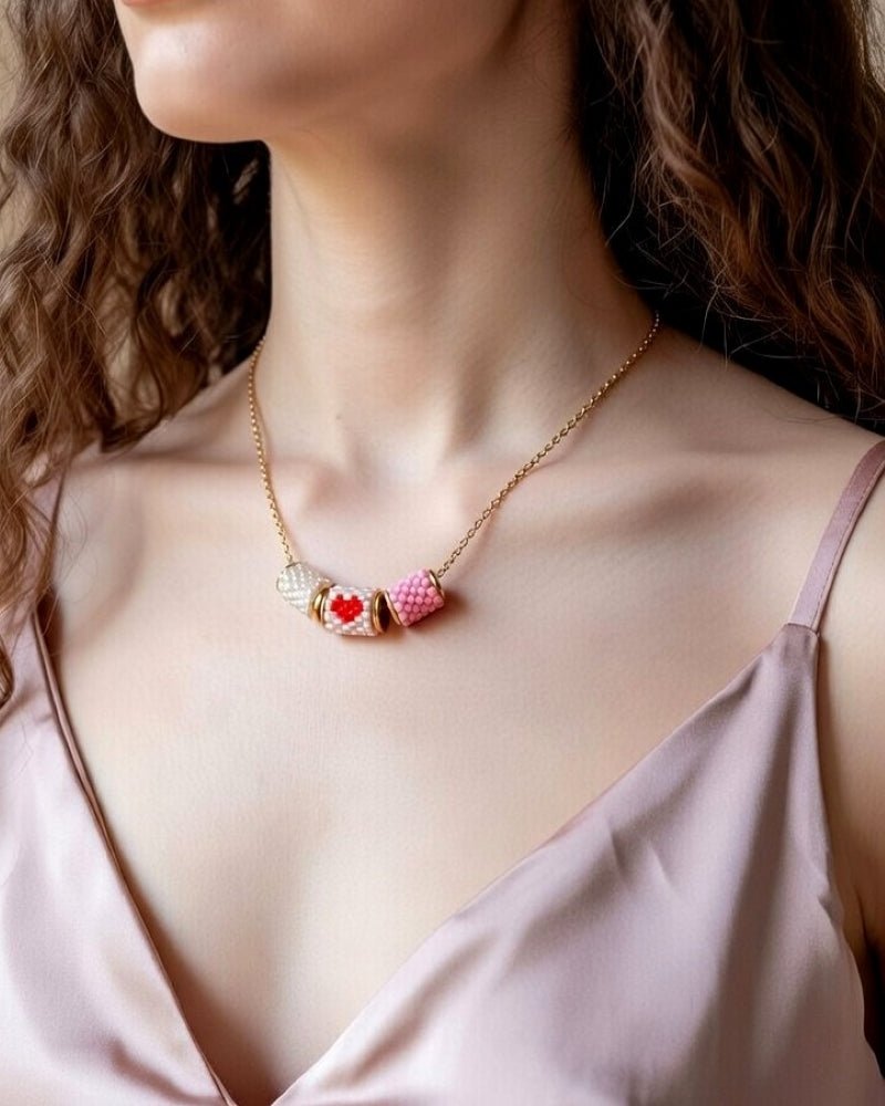 image Necklace with three beaded charms crafted in peyote stitch technique using Japanese Miyuki Delica beads in pink palette with scarlet heart motif - Fleur Du Jour