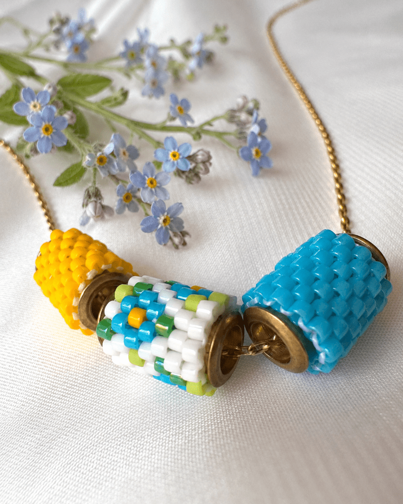 Collection of jewelry crafted in peyote stitch technique from Japanese Miyuki Delica beads in designs inspired by forget-me-not flowers - Fleur Du Jour
