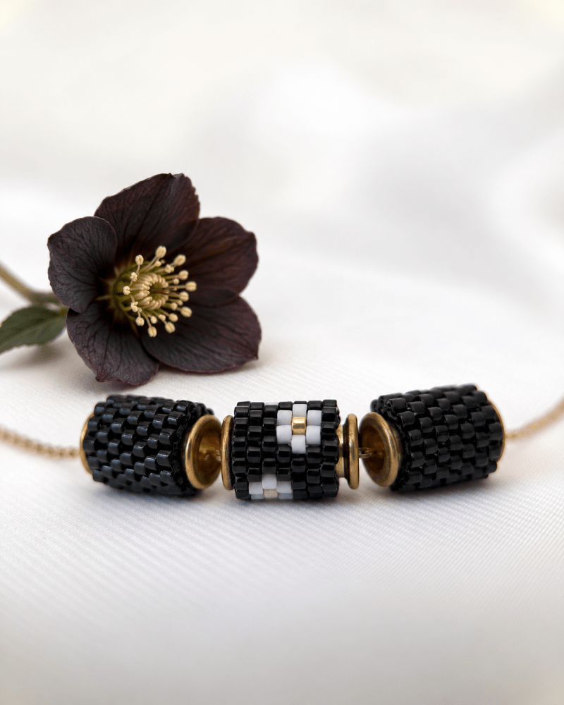 Collection of jewelry crafted in peyote stitch technique from Japanese Miyuki Delica beads in designs inspired by hellebore flower - Fleur Du Jour