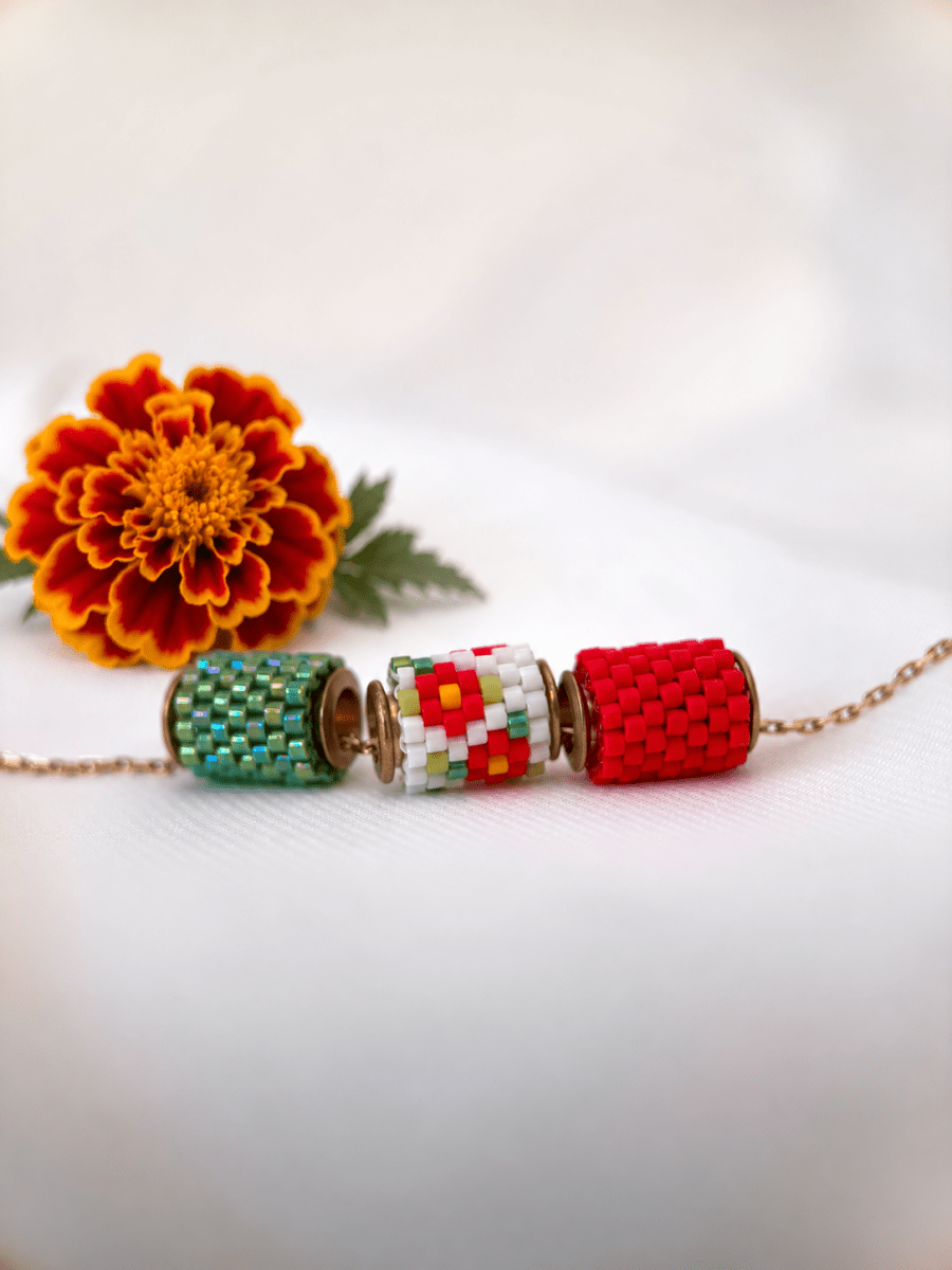 Collection of beaded jewelry created in peyote stitch technique from Japanese Miyuki beads in designs inspired by marigold flowers - Fleur Du Jour