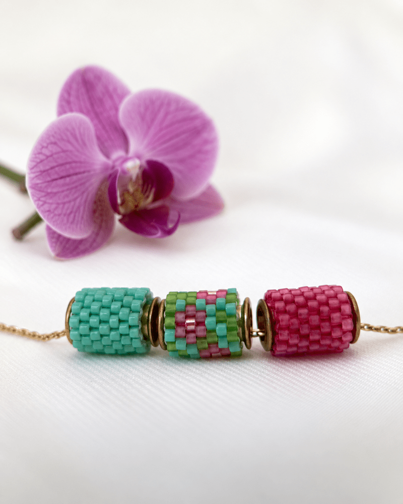Collection of beaded jewelry crafted in peyote stitch technique from Japanese Miyuki Delica beads in designs inspired by blossoming orchids - Fleur Du Jour