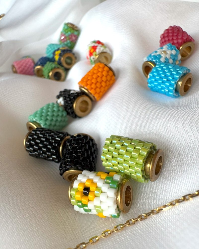 Collection of beaded pendants crafted in peyote stitch technique from Japanese Miyuki beads in a variety of designs and colors inspired by flowers - Fleur Du Jour