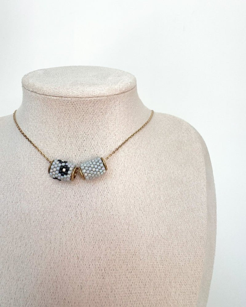 Necklace with three beaded charms crafted in peyote stitch technique using Japanese Miyuki Delica beads in neutral grey and black color palette - Fleur Du Jour