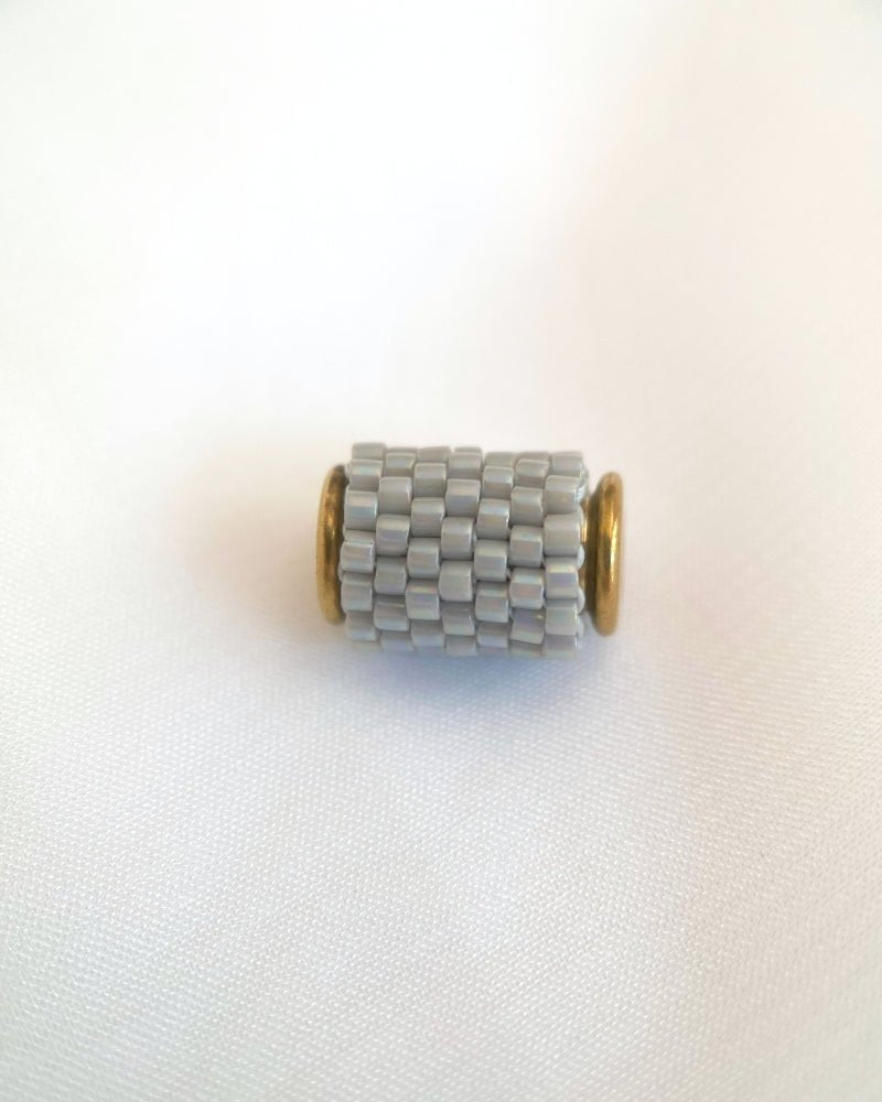 Single beaded pearl grey pendant crafted in peyote stitch technique from Japanese Miyuki Delica beads - Fleur Du Jour