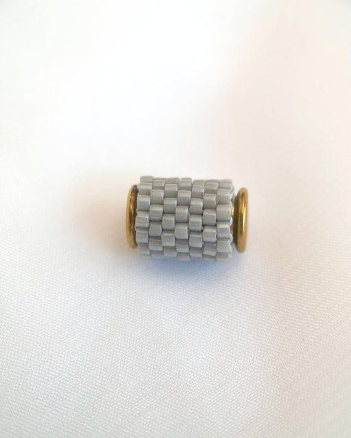 Single beaded pearl grey pendant crafted in peyote stitch technique from Japanese Miyuki Delica beads - Fleur Du Jour