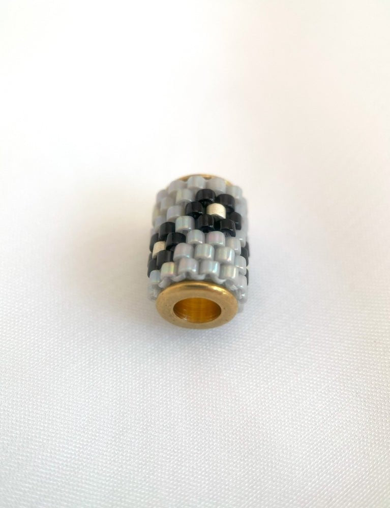 Single beaded pendant crafted in peyote stitch technique from Japanese Miyuki Delica beads in neutral design inspired by edelweiss flower - Fleur Du Jour