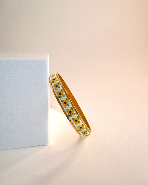 Gold-plated bangle bracelet with beaded inlay crafted in peyote stitch technique from Japanese Miyuki beads in a color palette inspired by sunflowers - Fleur Du Jour