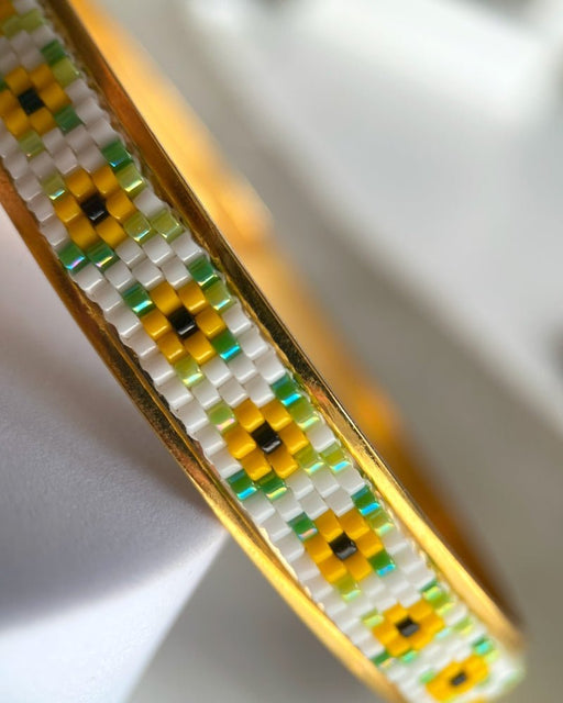 Gold-plated bangle bracelet with beaded inlay crafted in peyote stitch technique from Japanese Miyuki beads in a color palette inspired by sunflowers - Fleur Du Jour