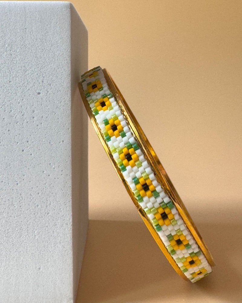 Gold-plated bangle bracelet with beaded inlay crafted in peyote stitch technique from Japanese Miyuki beads in a color palette inspired by sunflowers - Fleur Du Jour