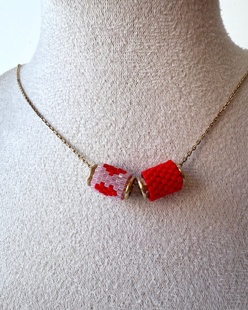 Necklace with three beaded charms crafted in peyote stitch technique using Japanese Miyuki Delica beads in scaret red and pale pink palette with heart motif - Fleur Du Jour