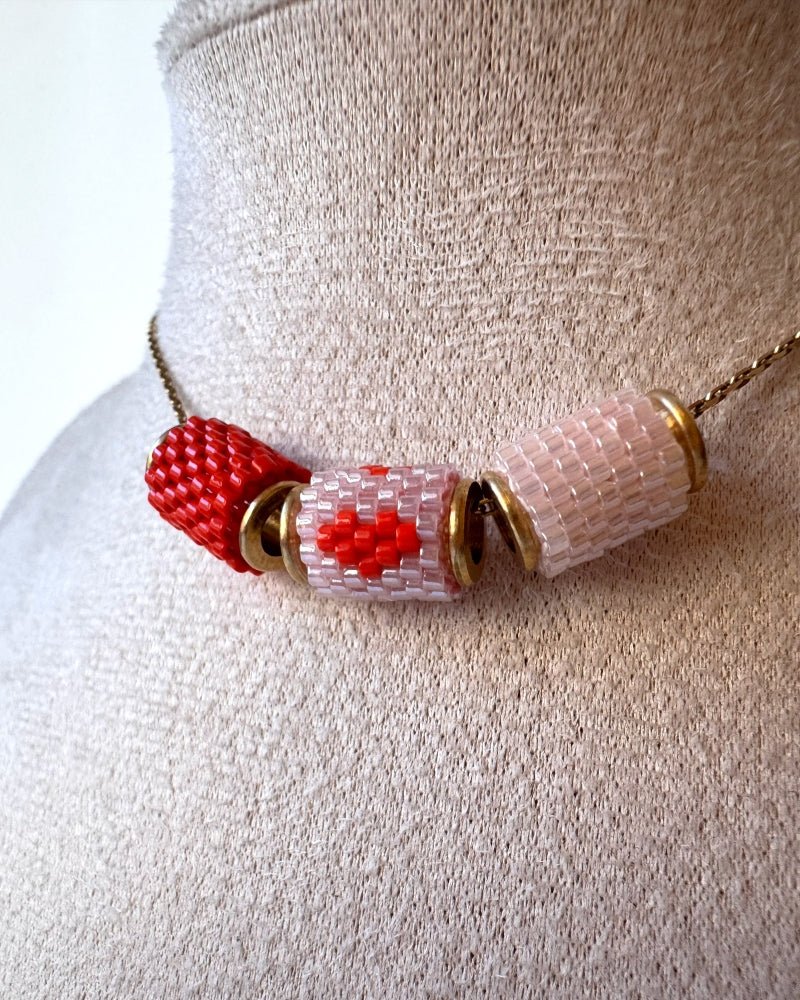 Necklace with three beaded charms crafted in peyote stitch technique using Japanese Miyuki Delica beads in scaret red and pale pink palette with heart motif - Fleur Du Jour