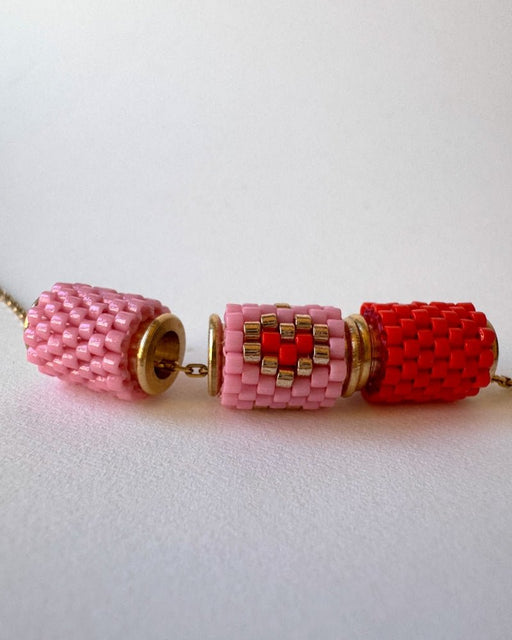 Necklace with three beaded charms crafted in peyote stitch technique using Japanese Miyuki Delica beads in scarlet red and pink palette with heart motif - Fleur Du Jour