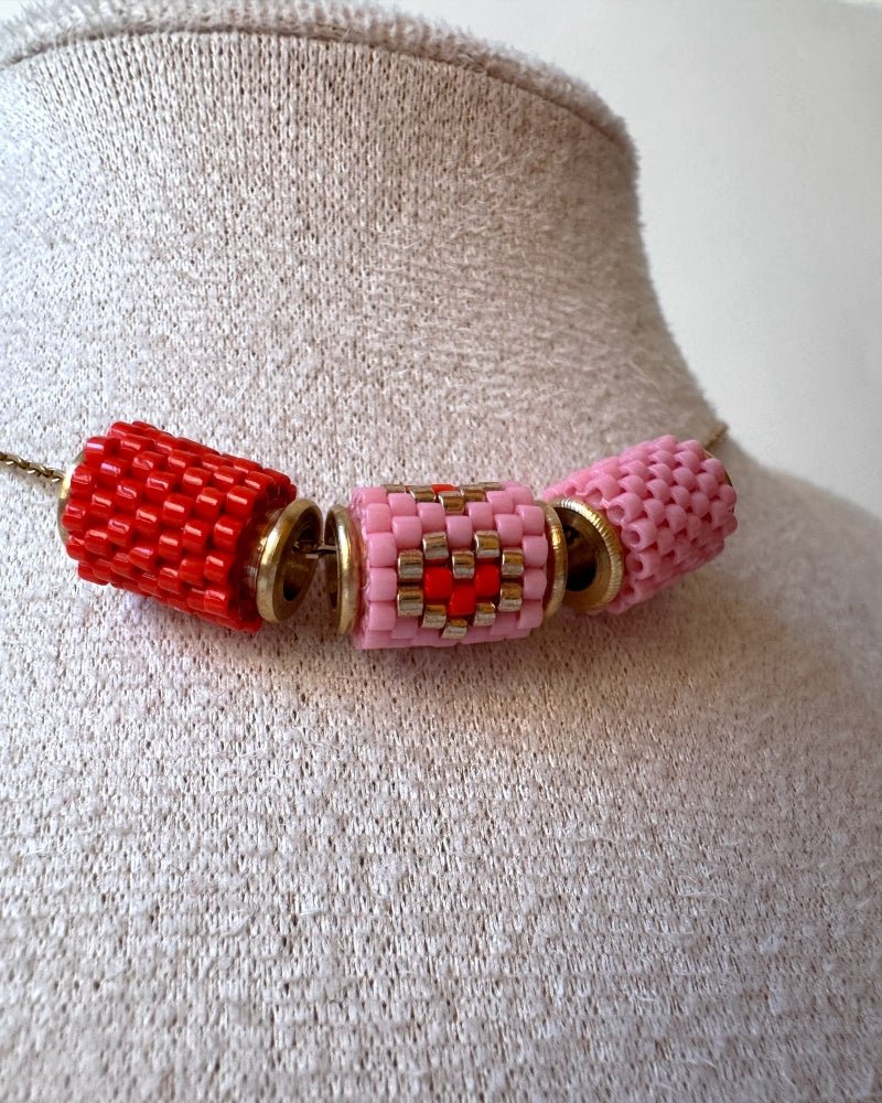 Necklace with three beaded charms crafted in peyote stitch technique using Japanese Miyuki Delica beads in scarlet red and pink palette with heart motif - Fleur Du Jour