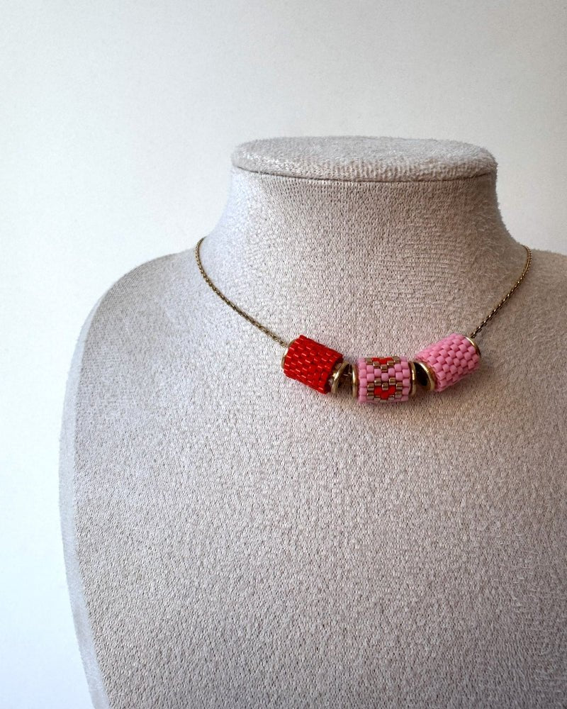 image Necklace with three beaded charms crafted in peyote stitch technique using Japanese Miyuki Delica beads in scarlet red and pink palette with heart motif - Fleur Du Jour