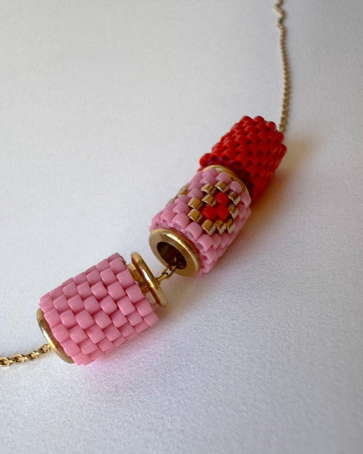 Necklace with three beaded charms crafted in peyote stitch technique using Japanese Miyuki Delica beads in scarlet red and pink palette with heart motif - Fleur Du Jour