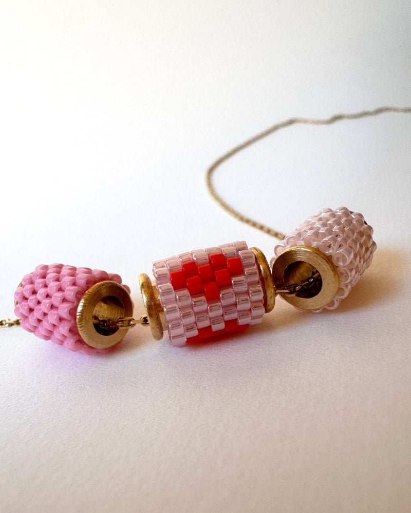 Necklace with three beaded charms crafted in peyote stitch technique using Japanese Miyuki Delica beads in pink palette with scarlet heart motif - Fleur Du Jour