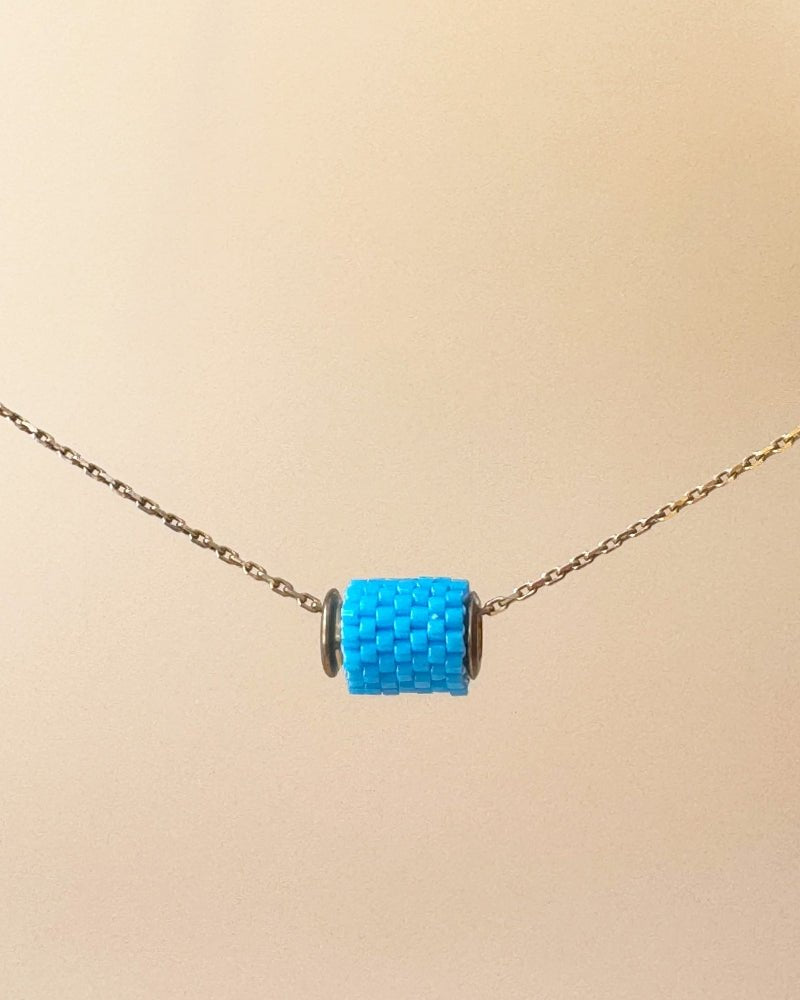 Single beaded pendant crafted in peyote stitch technique from Japanese Miyuki beads in azure blue color - Fleur Du Jour