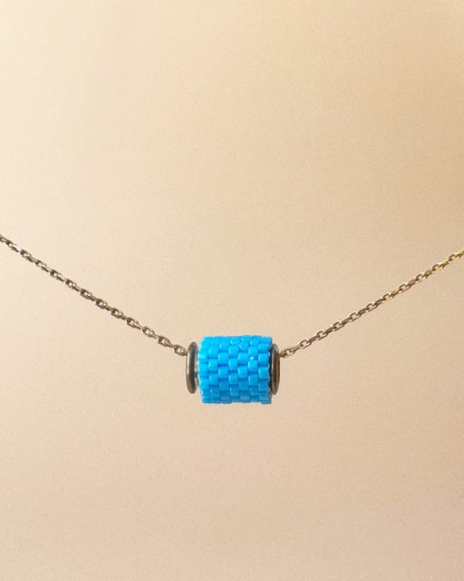 Single beaded pendant crafted in peyote stitch technique from Japanese Miyuki beads in azure blue color - Fleur Du Jour