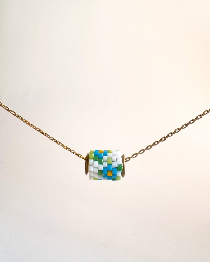 Single beaded pendant crafted in peyote stitch technique from Japanese Miyuki beads in a color palette inspired by forget-me-not flowers - Fleur Du Jour