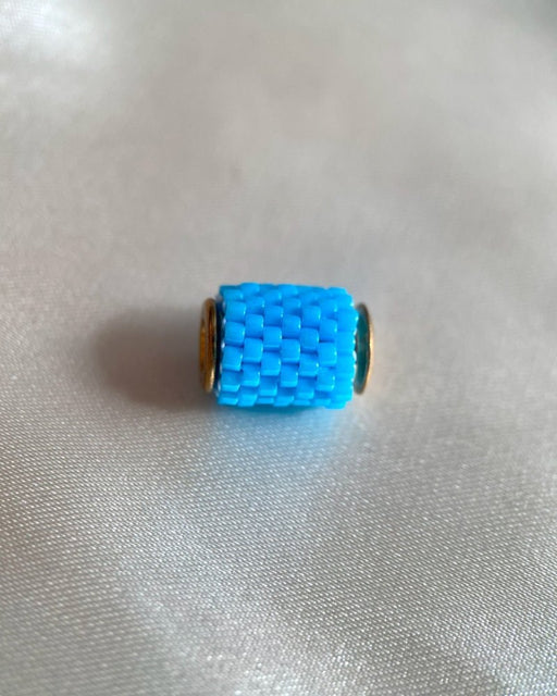 Single beaded pendant crafted in peyote stitch technique from Japanese Miyuki beads in azure blue color - Fleur Du Jour