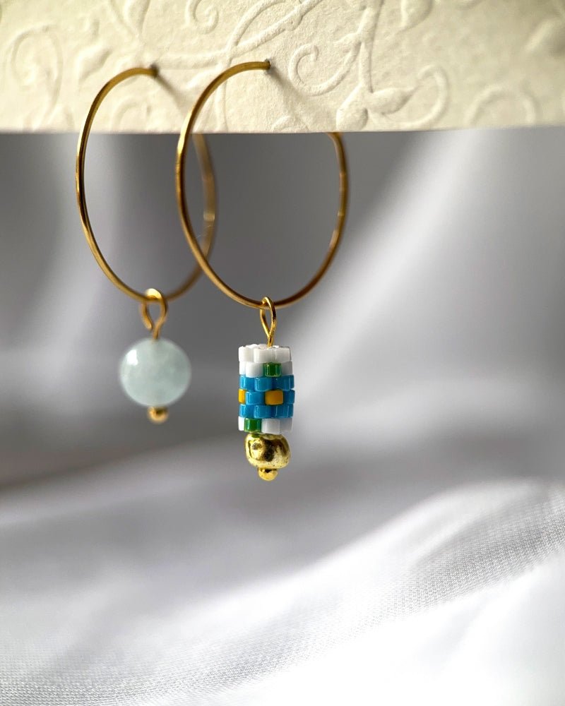 Customizable hoop earrings each with a set of interchangeable charms - beaded, stone and gold - for a new look every day - Fleur Du Jour